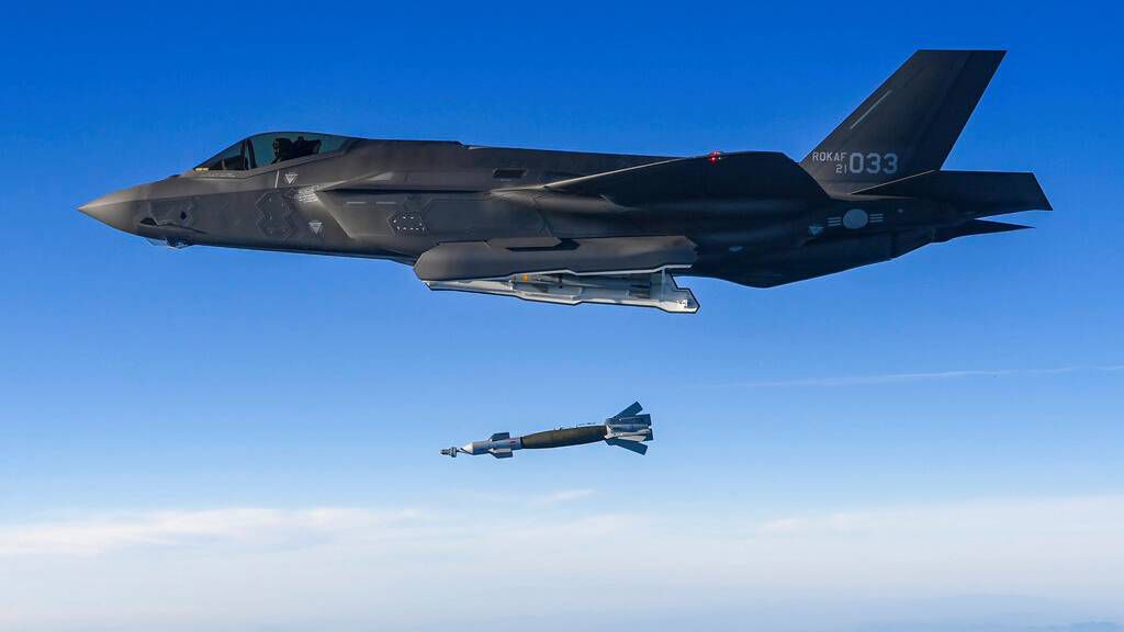 In this photo provided by South Korean Defense Ministry, South Korean Air Force F-35 fighter jet fires a GBU-12 aerial laser-guided bomb at a firing range near its land border with North Korea, South Korea, Friday, Nov. 18, 2022. South Korea's military said Friday its F-35 fighter jets conducted drills simulating aerial strikes on North Korean mobile missile launchers at a firing range near its land border with North Korea. It said a group of eight South Korean and U.S. fighter jets separately performed flight training off the Korean Peninsula's east coast. (South Korean Defense Ministry via AP)