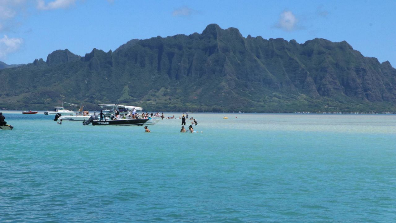 DOCARE reminds the public that alcohol is prohibited at Ahu o Laka (also known as Kaneohe sandbar) on three-day weekends during the summer. Officers will be enforcing the rules on land and in the water for the Fourth of July weekend (Courtesy DOCARE)