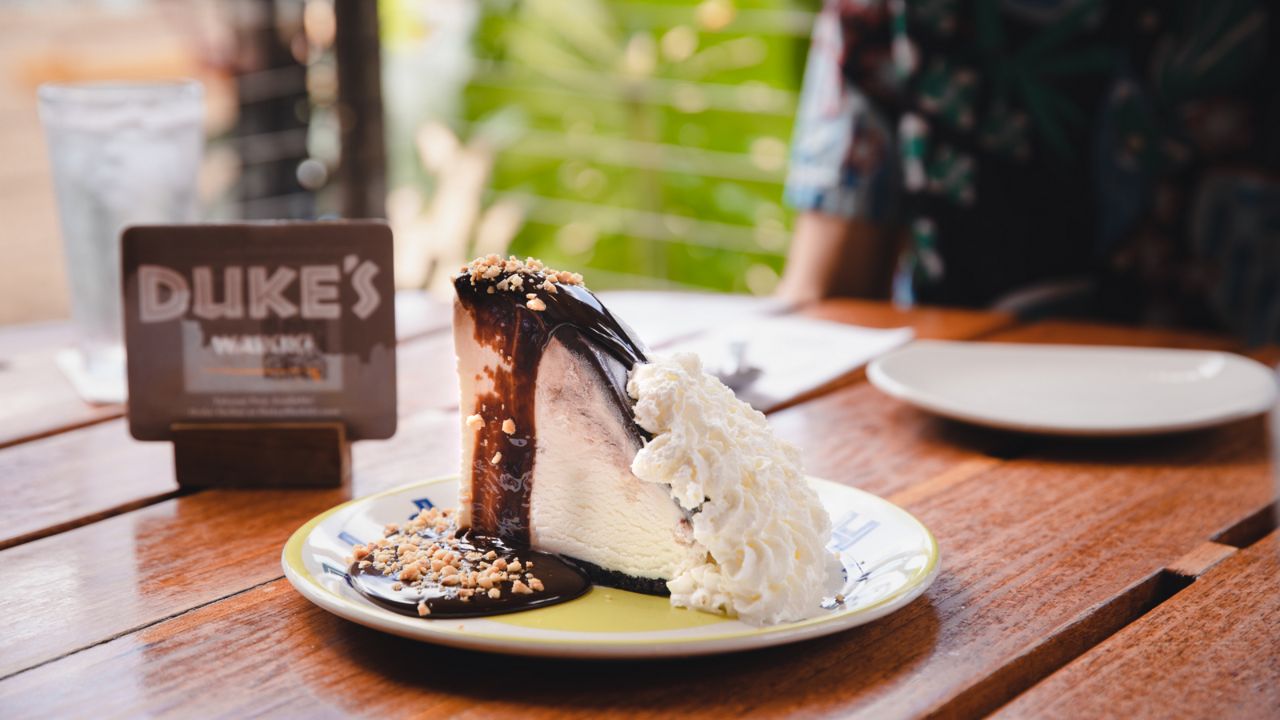 The inspiration: The Hula Pie is a towering dessert made of macadamia nut ice cream in a chocolate cookie crust that's topped with chocolate fudge, whipped cream and drizzled even more (hot) fudge. (Courtesy TS Restaurants)