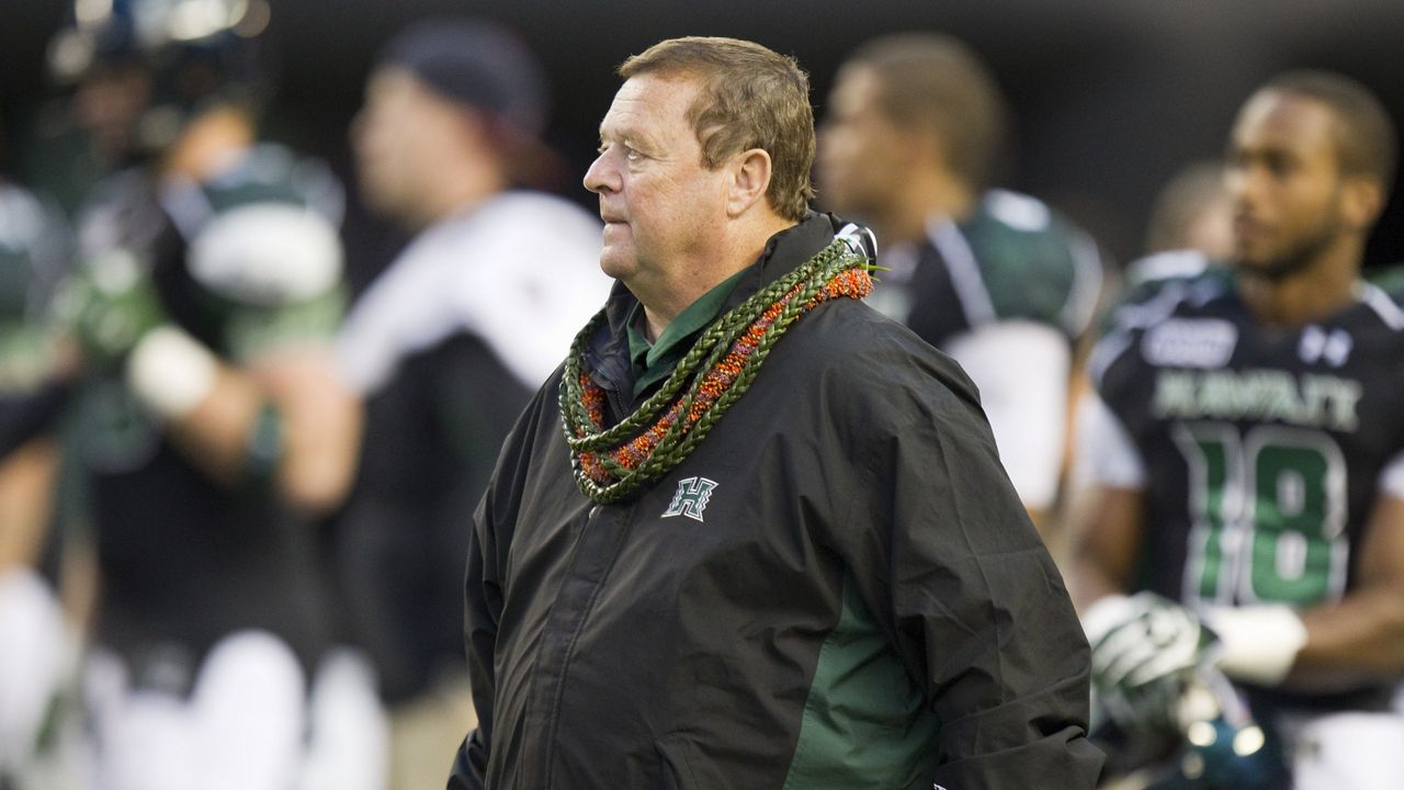 Hawaii head coach Greg McMackin watches his team warmup before the start of the Tulane vs Hawaii NCAA college football game Saturday, Nov. 26, 2011, in Honolulu. (AP Photo/Eugene Tanner)