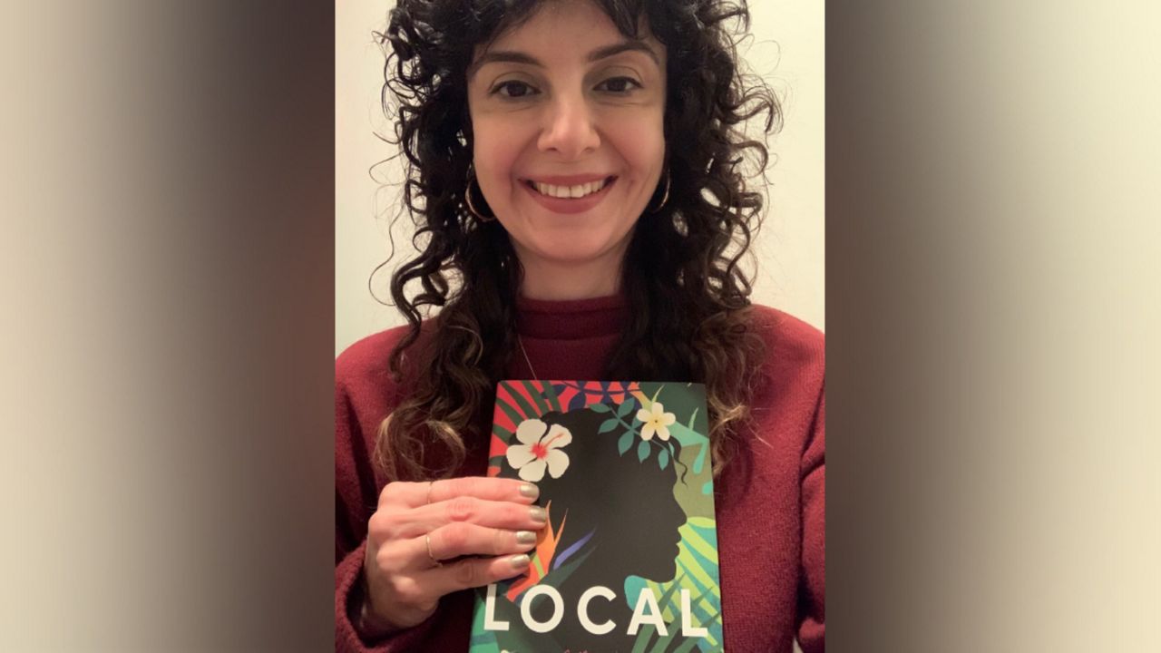 Jessica Machado with her book, "Local." (Photo courtesy of Jessica Machado)