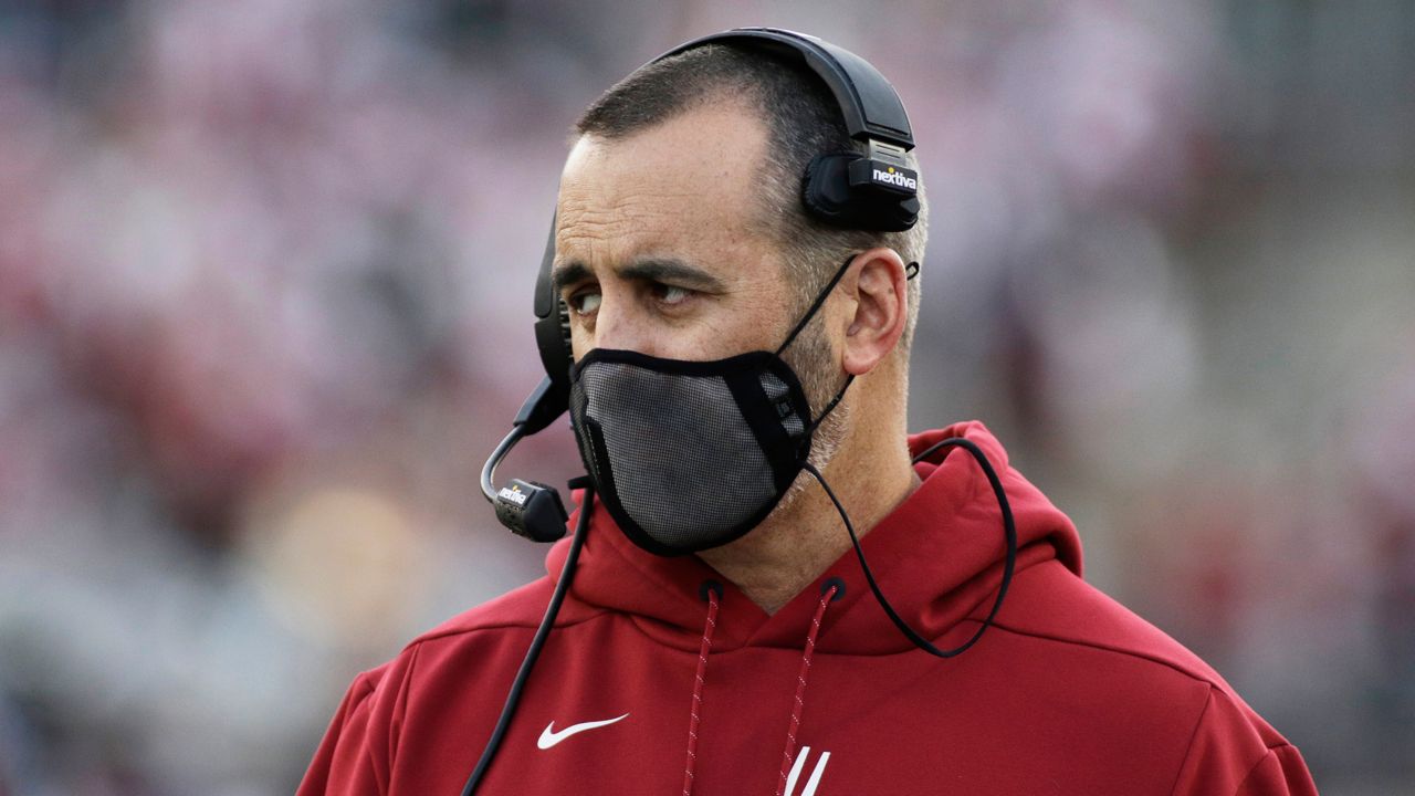 Washington State coach Nick Rolovich watches during the first half of an NCAA college football game against Stanford on Oct. 16, 2021, in Pullman, Wash. The former Washington State football coach has filed a claim against the university on April 27, 2022, seeking $25 million for wrongful termination after he was fired last year for refusing to get vaccinated against COVID-19. (AP Photo/Young Kwak, File)