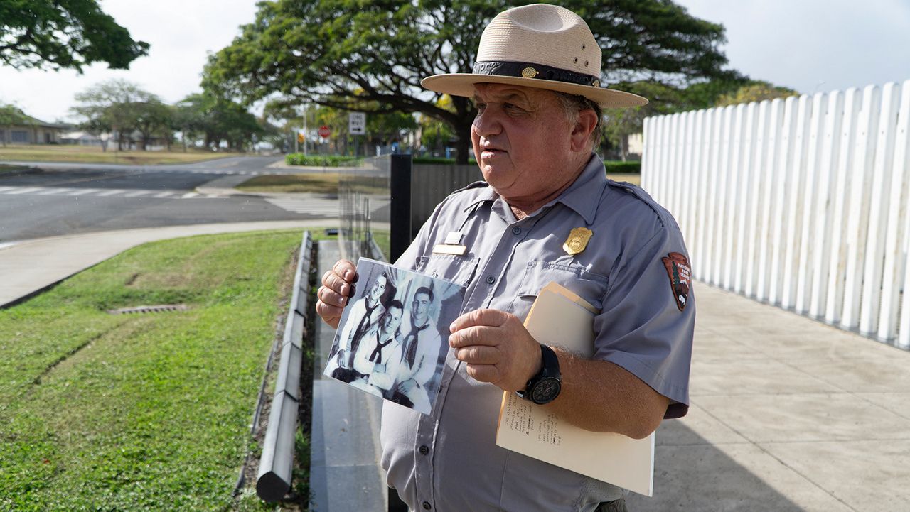 The National Park Service adds another facet to the Pearl Harbor programs with new Ford Island Bus Tours beginning May 9. Here, Park Ranger Phil Lingenfelter stands in front of the USS Oklahoma Memorial. (Spectrum News/Sarah Yamanaka)