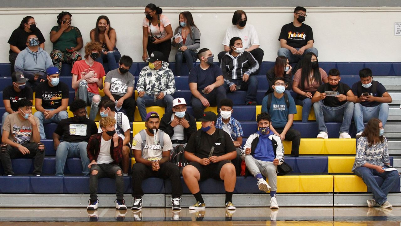 One Polk County mother is encouraging other parents and their children to get vaccinated and stay masked after her 16-year-old came down with a serious case of COVID-19 just days into his first week of school. (Associated Press)