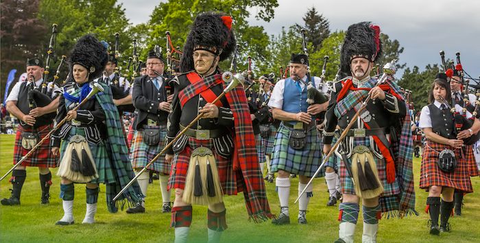 Men in kilts playing bagpipes