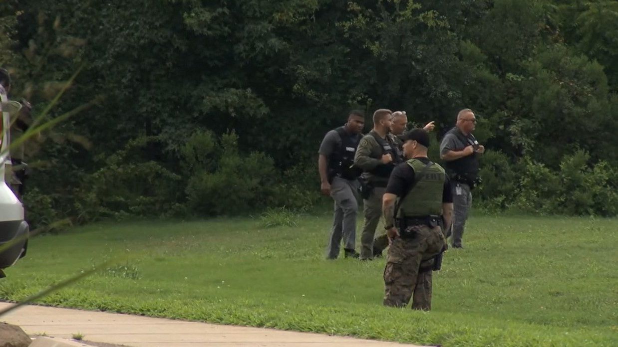 Officers are going door to door in Hillsborough as they search for Ramone Alston, who was convicted in the 2015 Christmas Day killing of a 1-year-old. Alston escaped custody Tuesday morning. (Spectrum News 1/Zyneria Byrd)