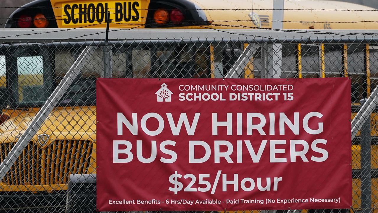 A hiring sign is displayed at a school in Palatine, Ill., Wednesday, Nov. 8, 2023. (AP Photo/Nam Y. Huh)