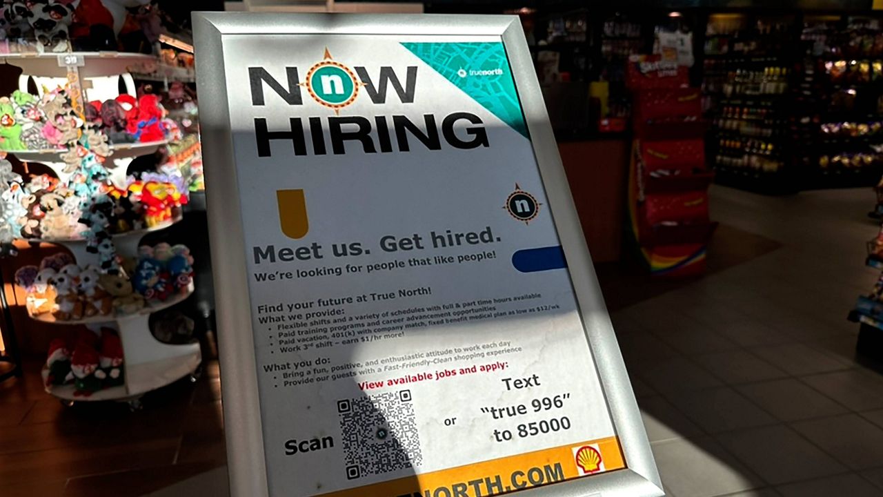 A hiring sign is displayed at a convenience store in Buffalo Grove, Ill., Monday, Feb. 12, 2024. (AP Photo/Nam Y. Huh)
