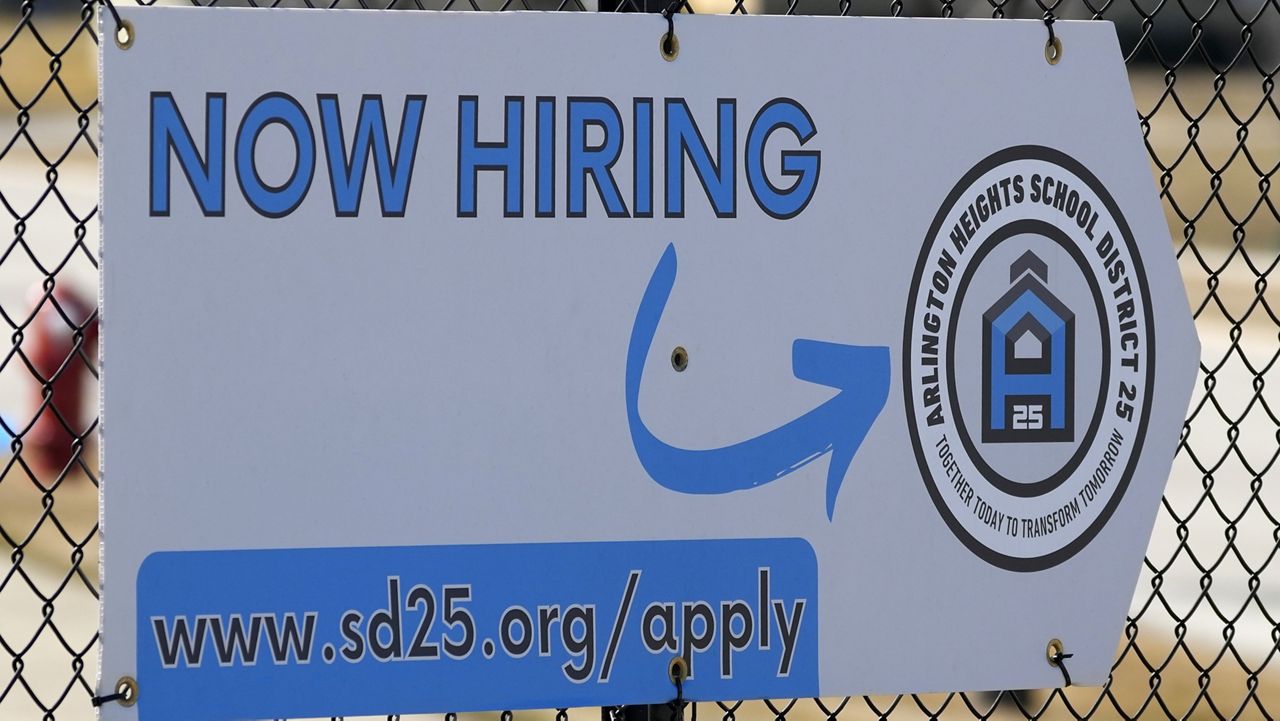 A hiring sign is displayed in Arlington Heights, Ill., Monday, Feb. 26, 2024. (AP Photo/Nam Y. Huh)