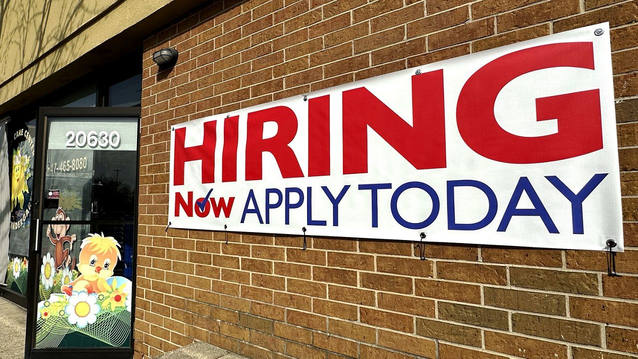 A hiring sign is displayed in Riverwoods, Ill., Tuesday, April 16, 2024. (AP Photo/Nam Y. Huh)