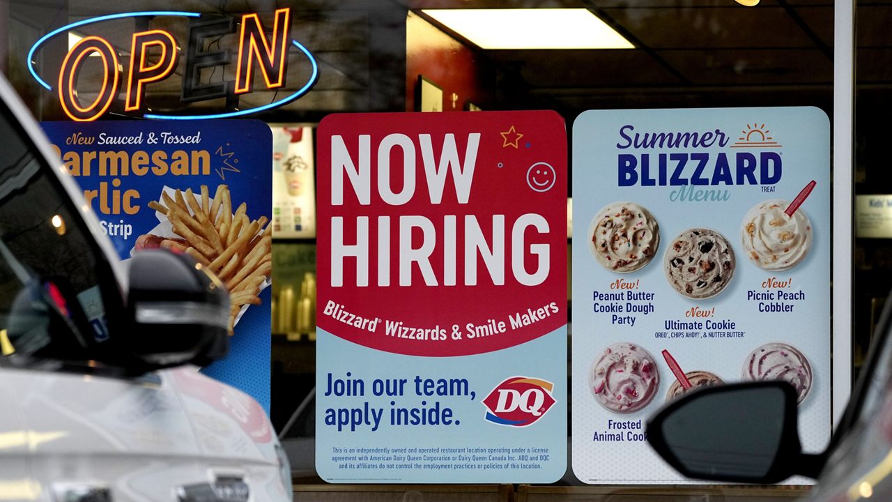 A hiring sign is displayed at a restaurant in Northbrook, Ill., Thursday, May 2, 2024. (AP Photo/Nam Y. Huh)