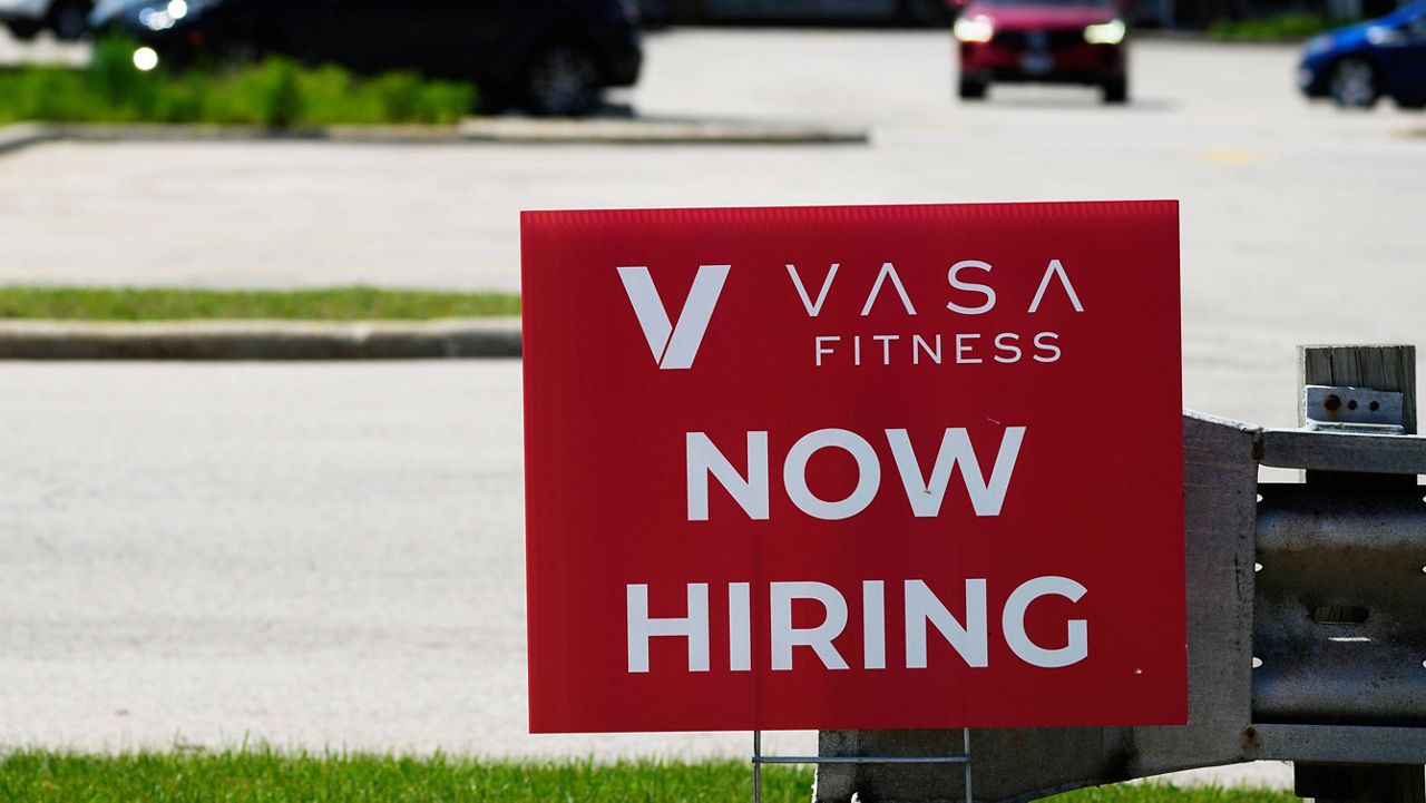 A hiring sign is displayed in Northbrook, Ill., Monday, June 3, 2024. (AP Photo/Nam Y. Huh)