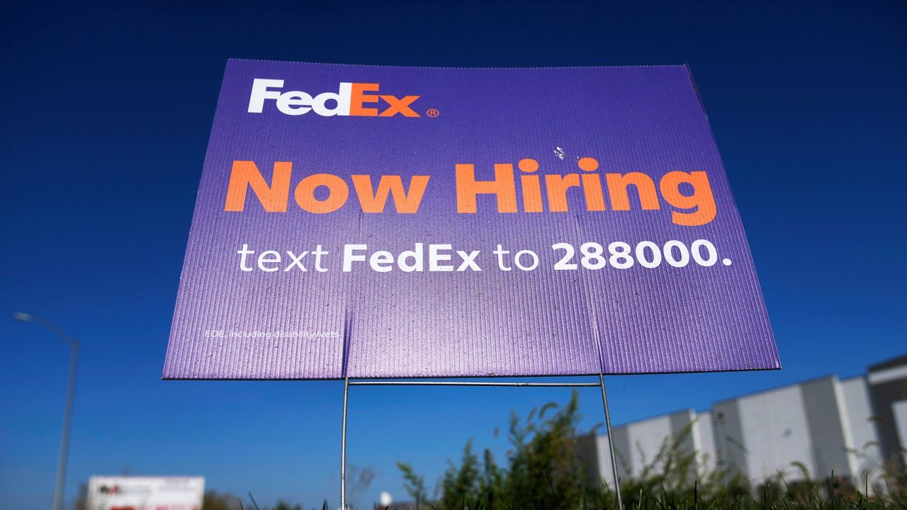 A hiring sign for employment at FedEx is seen, Wednesday, Sept. 4, 2024, in Grimes, Iowa. (AP Photo/Charlie Neibergall)