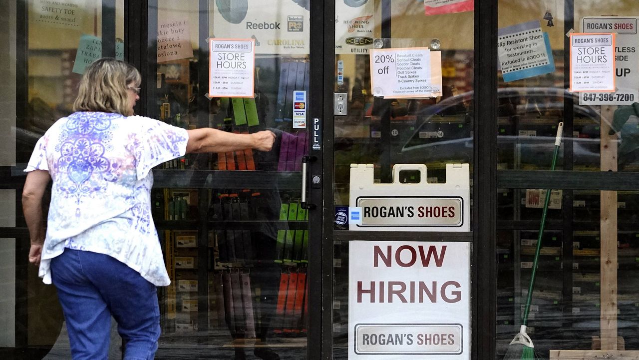 A hiring sign is displayed outside a retail store in Buffalo Grove, Ill. (AP Photo/Nam Y. Huh)