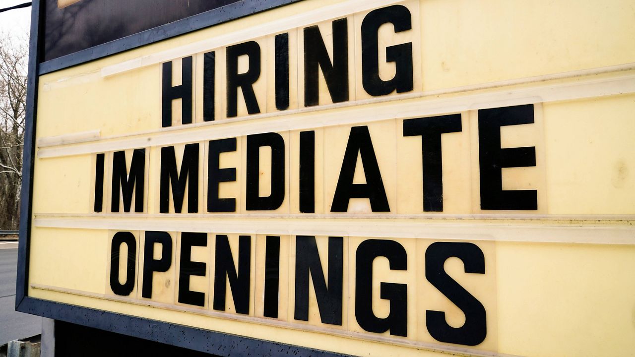 A hiring sign is posted outside business in Huntingdon Valley, Pa., on Feb. 22. (AP Photo/Matt Rourke)