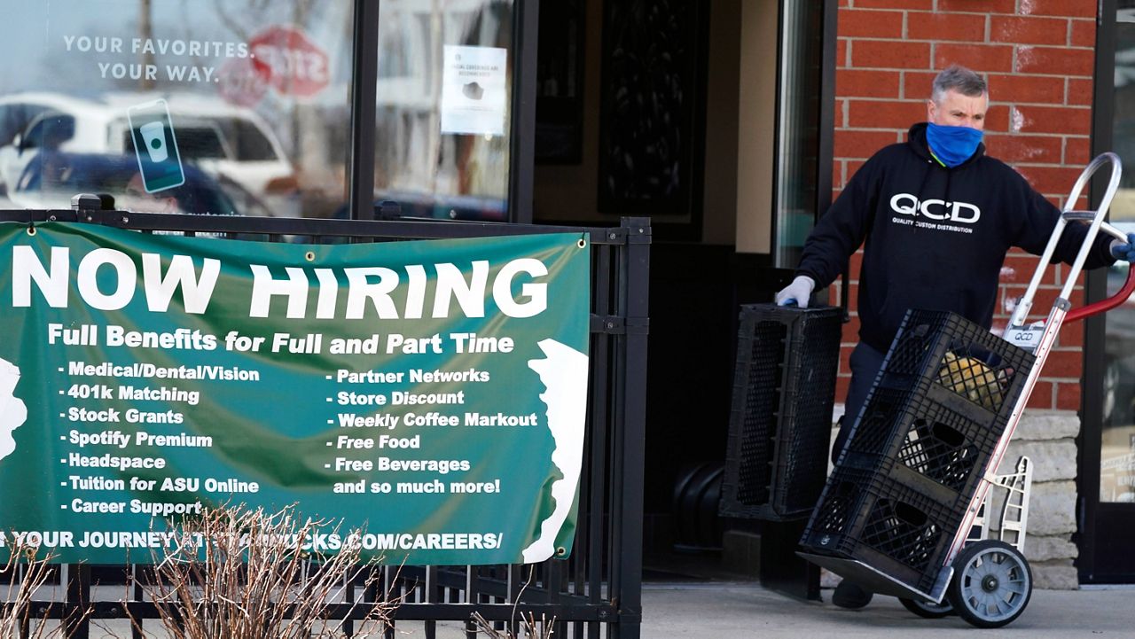 A hiring sign is displayed outside of a Starbucks in Schaumburg, Ill., on April 1. (AP Photo/Nam Y. Huh, File)
