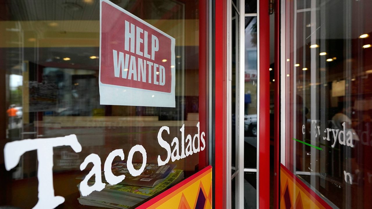 A help-wanted sign is posted at the front entrance to a restaurant in Providence, R.I., on June 2. (AP Photo/Steven Senne)