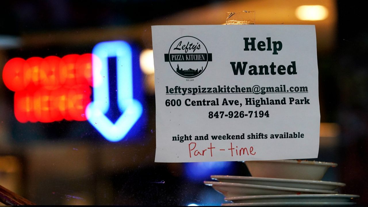 A hiring sign is displayed at a restaurant in Highland Park, Ill., on July 14. (AP Photo/Nam Y. Huh)