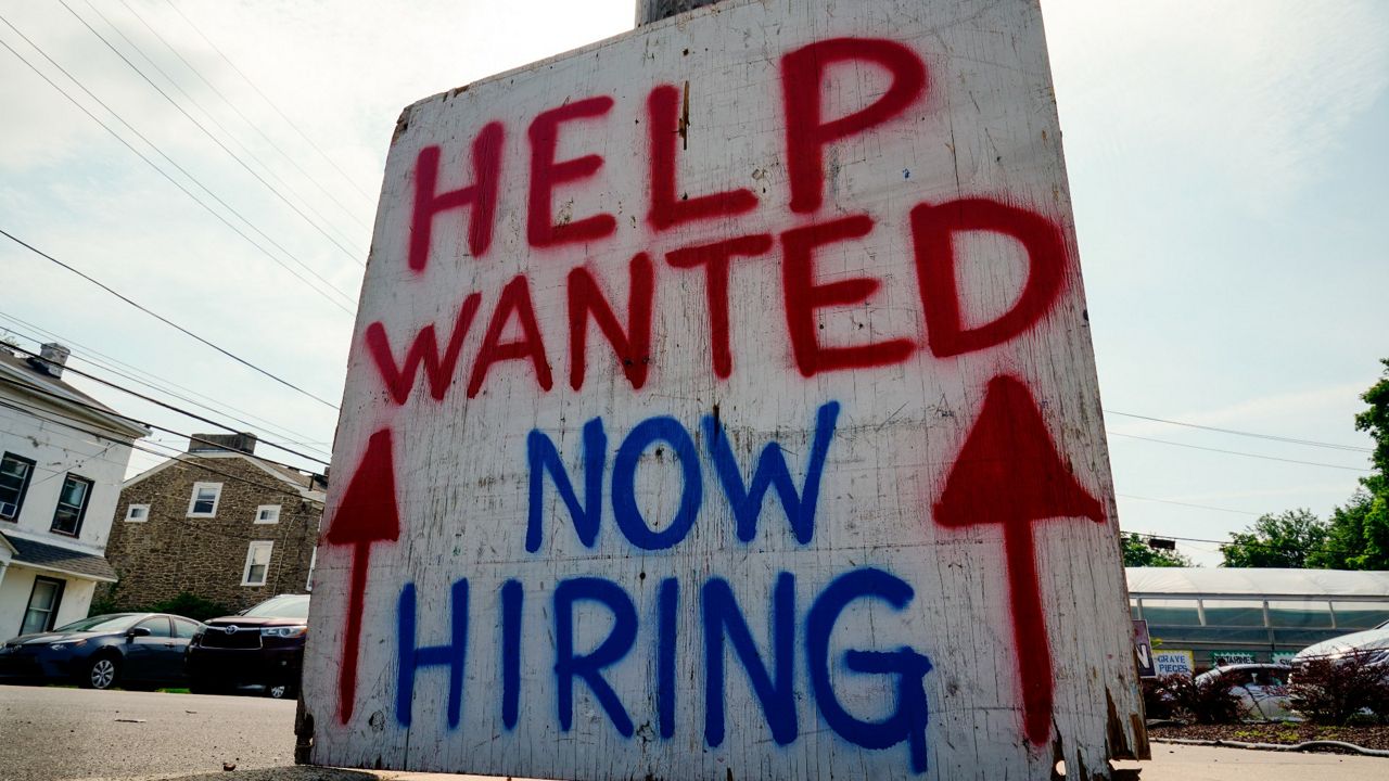 A help-wanted sign is posted outside of business in Philadelphia on June 22, 2022. (AP Photo/Matt Rourke)