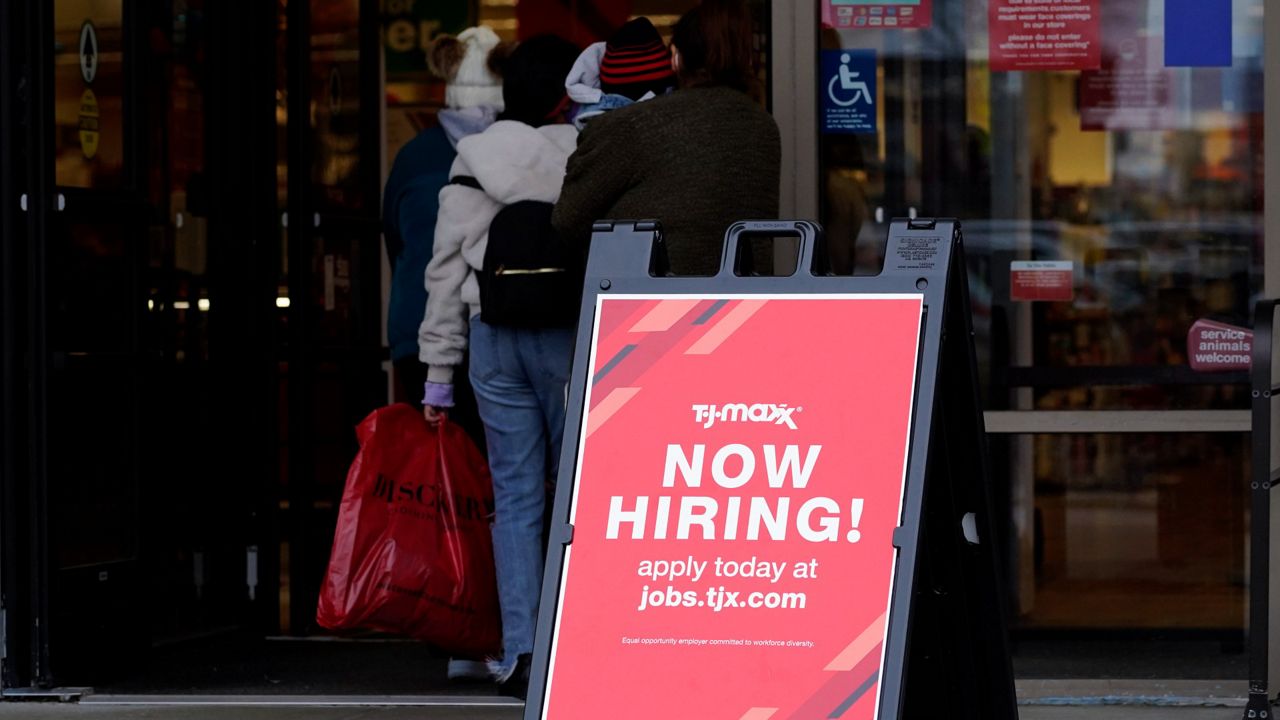 A hiring sign is displayed outside of a retail store in Vernon Hills, Ill., on Nov. 13, 2021. (AP Photo/Nam Y. Huh, File)