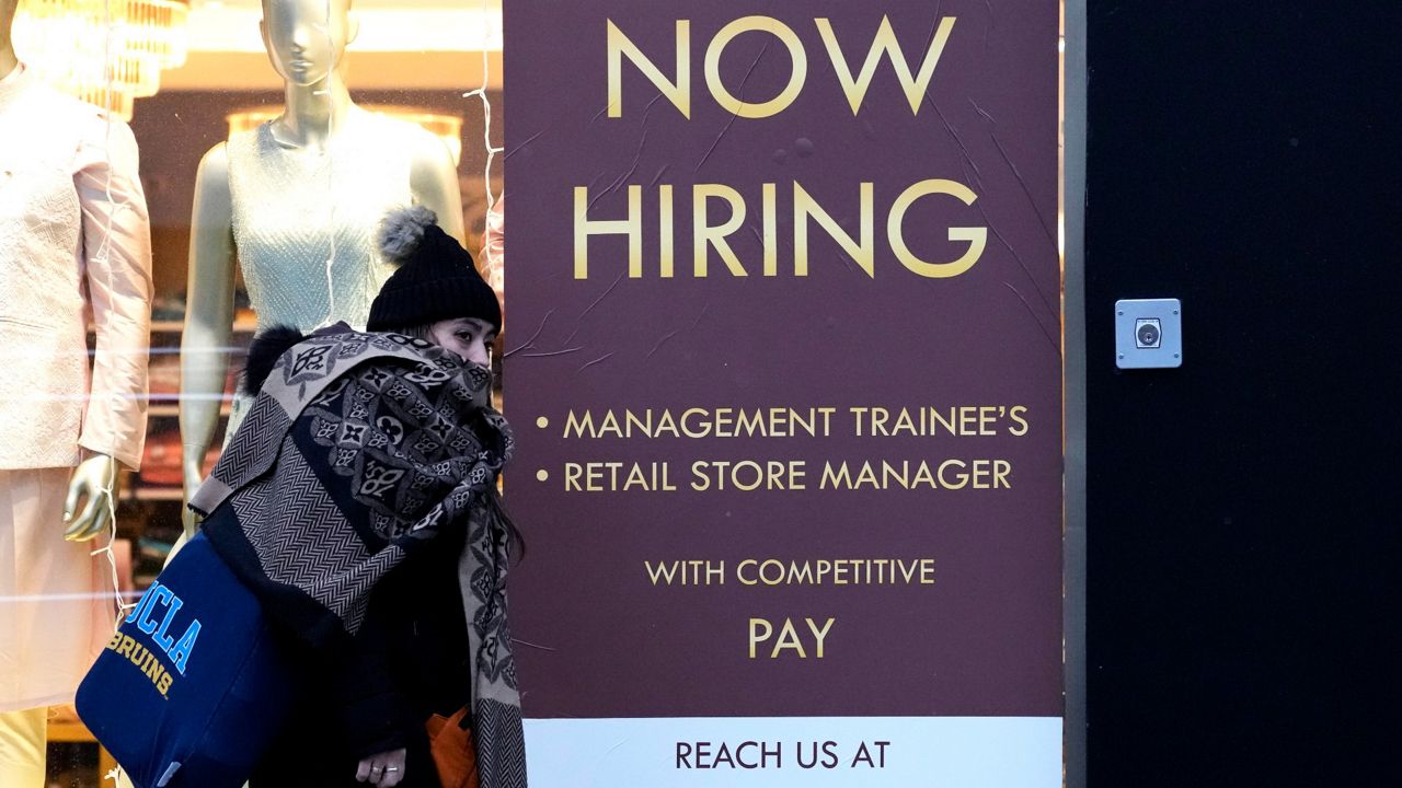 A hiring sign is displayed at a retail store in Chicago on Jan. 5. (AP Photo/Nam Y. Huh, File)