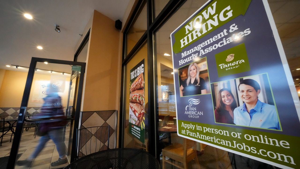 A hiring sign is displayed Monday in the window of a Panera Bread store in Pittsburgh. (AP Photo/Gene J. Puskar)