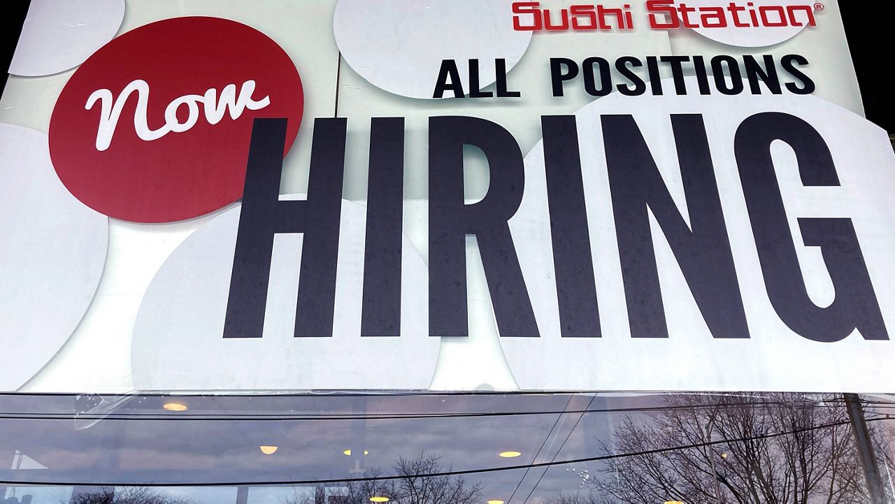 A hiring sign is displayed at a restaurant in Rolling Meadows, Ill., on Dec. 27, 2022. (AP Photo/Nam Y. Huh, File)