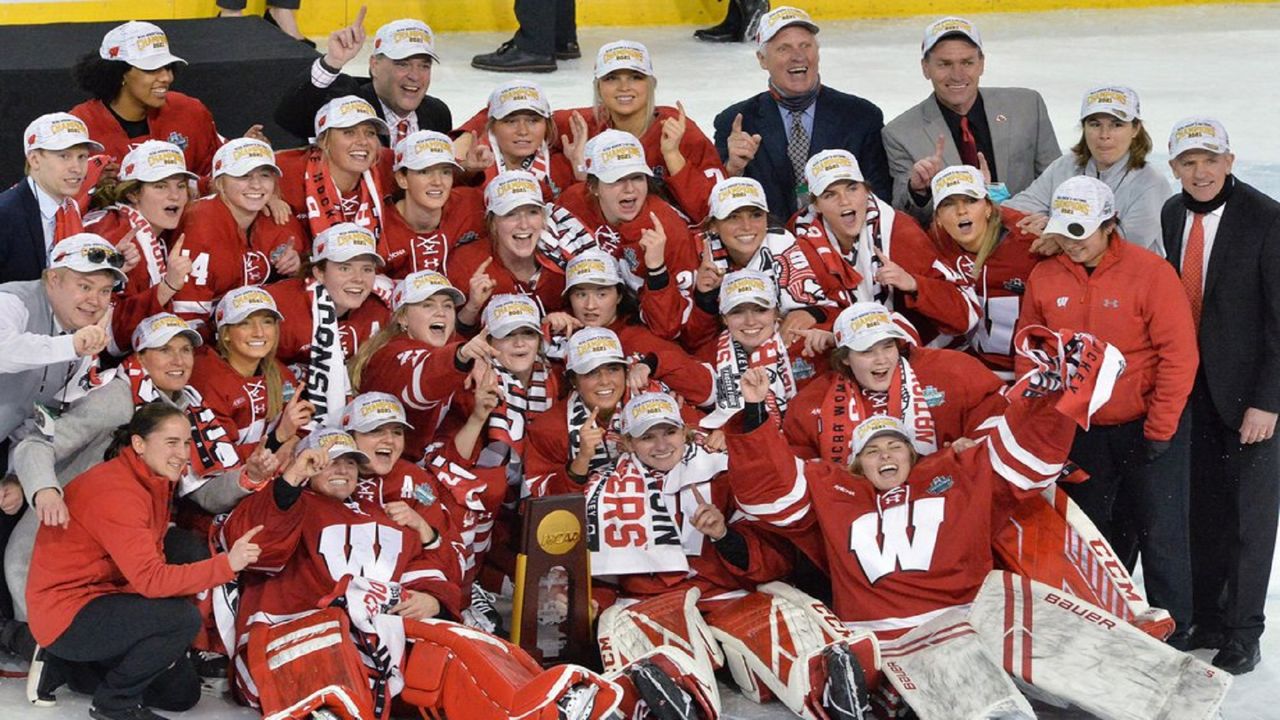 Wisconsin teammates celebrate their NCAA college Women's Frozen Four hockey tournament championship win over Northeastern, Saturday, March 20, 2021, at Erie Insurance Arena in Erie, Pa. (Greg Wohlford/Erie Times-News via AP)