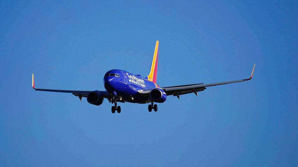 A Southwest Airlines flight from Buffalo, N.Y., makes its landing approach onto Baltimore-Washington International Thurgood Marshall Airport, Monday, Nov. 23, 2020, in Glen Burnie, Md. (AP Photo/Julio Cortez)