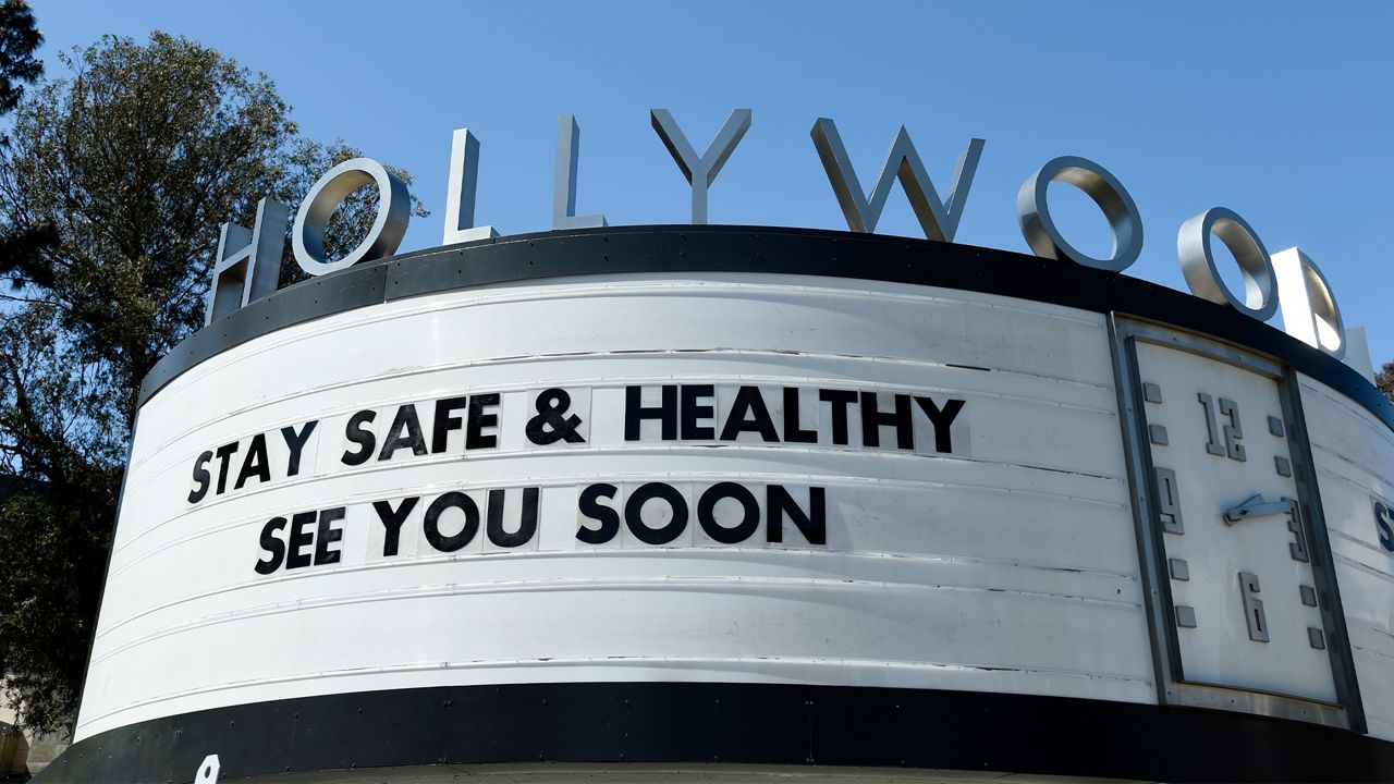 A marquee at the Hollywood Bowl concert venue bears a coronavirus-related message, Friday, March 27, 2020, in Los Angeles. (AP Photo/Chris Pizzello)
