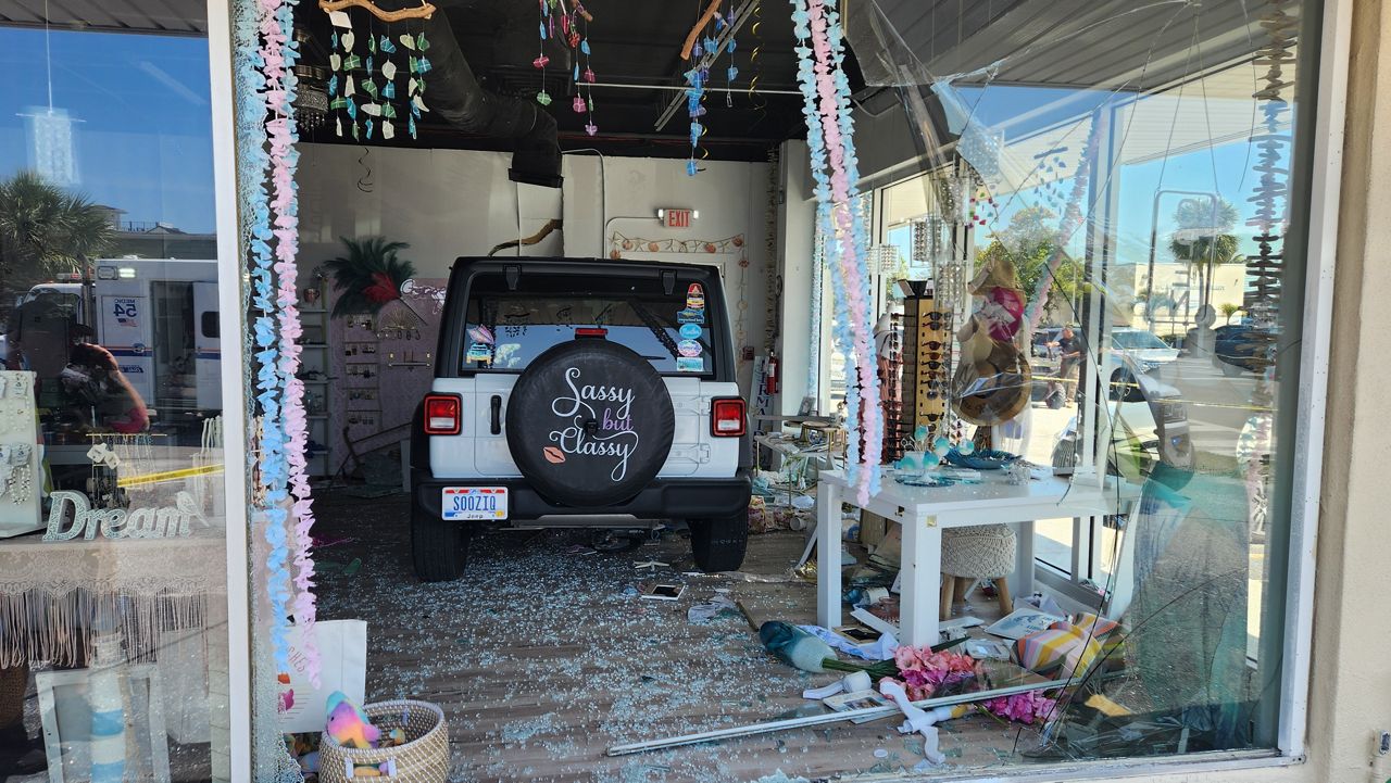 Shattered glass surrounds a Jeep inside Gypsea Tides Beach Boutique after it crashed through a storefront window. (Holmes Beach Police Department)