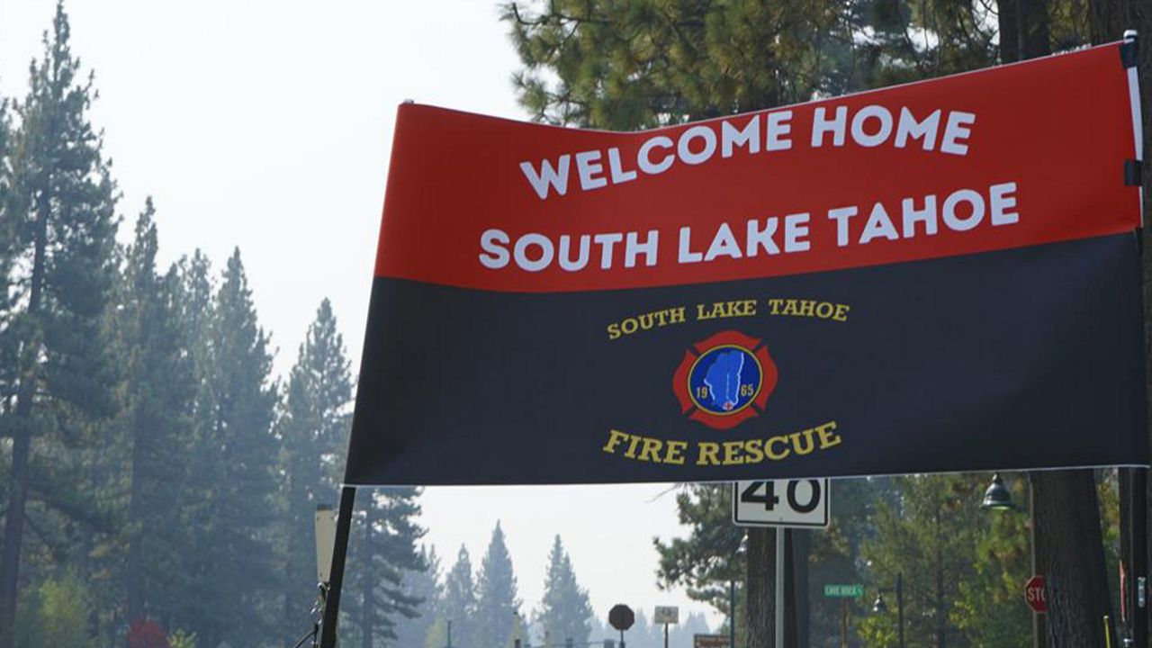 A sign outside a South Lake Tahoe Fire Station welcomes residents back to town after the lifting of the evacuation order Monday, Sept. 6, 2021. The resort town of some 22,000 was cleared last week due to the Caldor Fire. (AP Photo/Samuel Metz)