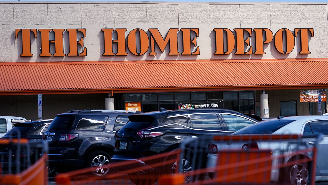 Shopping carts are parked outside a Home Depot in Philadelphia on Sept. 21, 2022. Home Depot is buying SRS Distribution, a materials provider for professionals, in a deal valued at approximately $18.25 billion. The home improvement retailer said Thursday, March 28, 2024, that the acquisition will help speed up its growth with the contractors. (AP Photo/Matt Rourke, File)