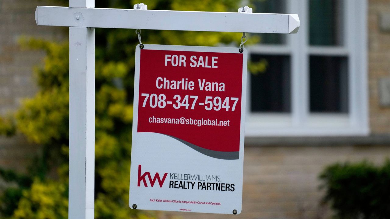 A for sale sign is displayed in front of a home in Wheeling, Ill., on May 2, 2024. (AP Photo/Nam Y. Huh, File)