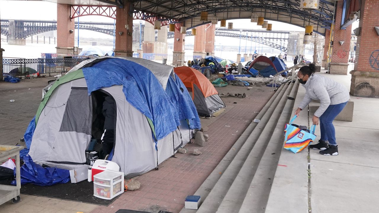 Volunteers assist the homeless after the encampment was told to leave the property, the St. Louis Riverfront in St. Louis on Friday, March 10, 2023. The encampment, which housed 30-40 people was told it would have to move from the riverfront shelter, once a dock for the Admiral Casino boat. A majority of the camp's occupants accepted housing options offered by the city.  Photo by Bill Greenblatt/UPI