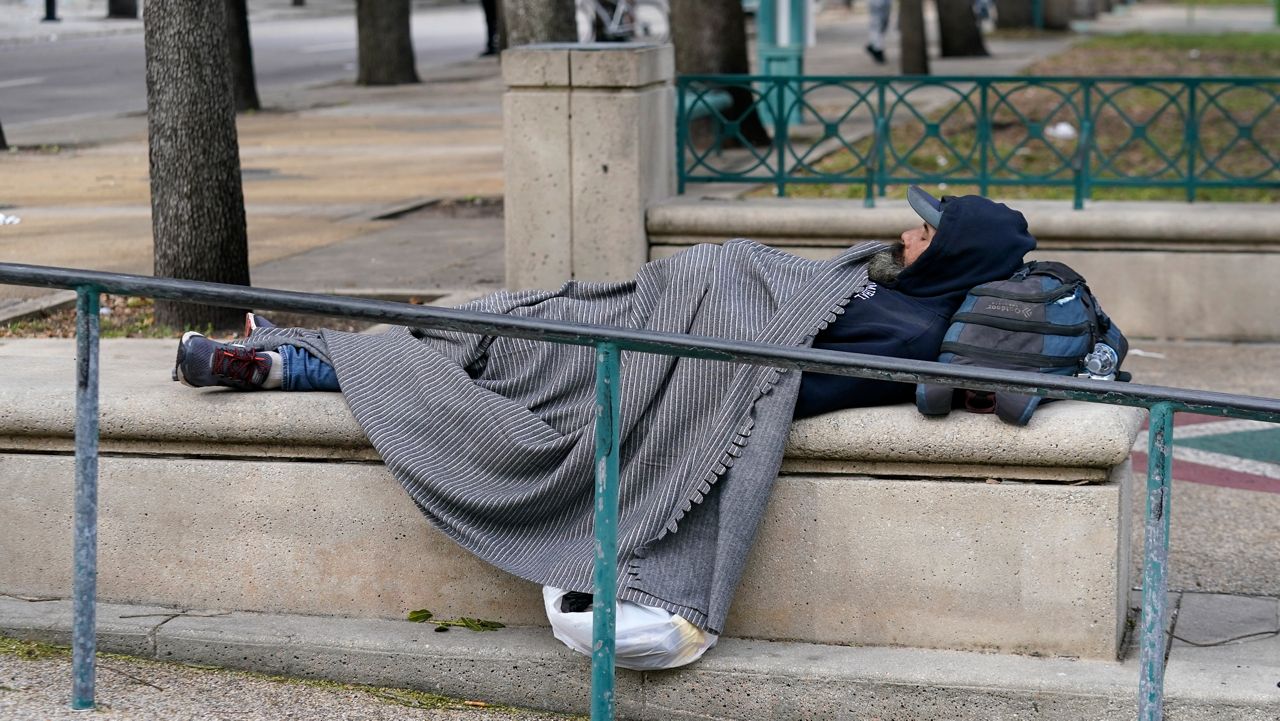 A new law that prohibits counties or municipalities from allowing public sleeping or camping in public places such as sidewalks and parks went into effect Tuesday. (AP Photo/Lynne Sladky, File)