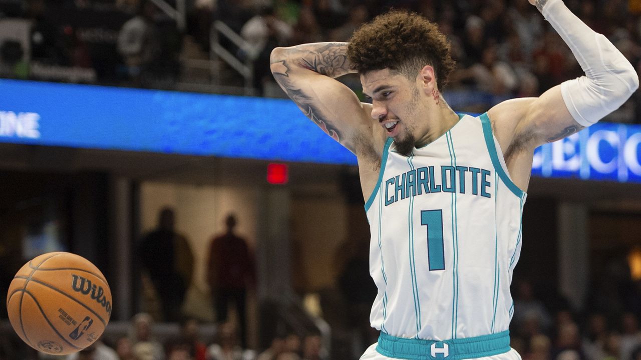 Charlotte Hornets' LaMelo Ball (1) watches the ball during the second half of an NBA basketball game against the Cleveland Cavaliers in Cleveland, Sunday, Nov 17, 2024. (AP Photo/Phil Long)