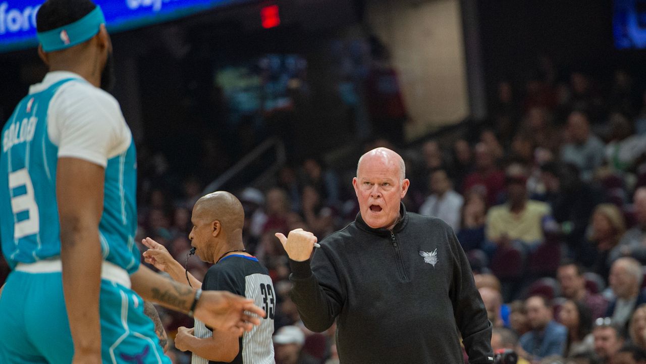 Charlotte Hornets head coach Steve Clifford, right, talks with Marques Bolden (3) during an NBA basketball game against the Cleveland Cavaliers in Cleveland, Sunday, April 14, 2024. (AP Photo/Phil Long)