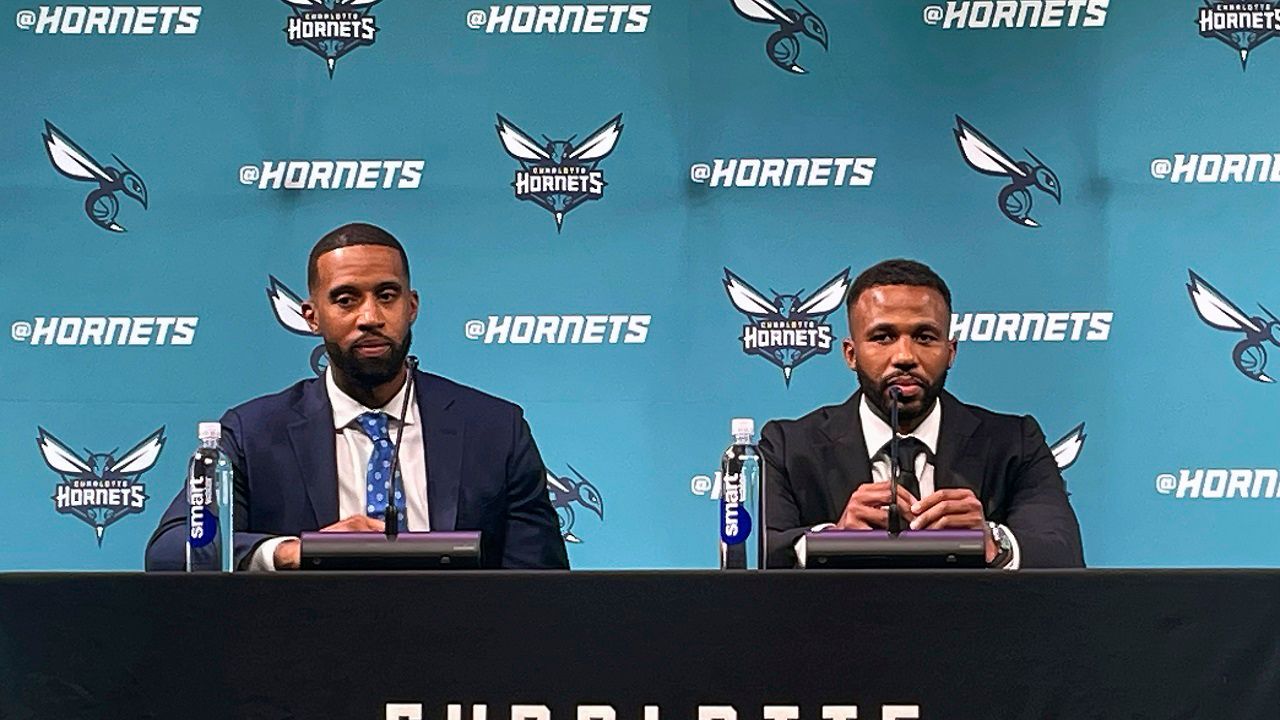 New Charlotte Hornets head coach Charles Lee, left, is introduced by Hornets general manager Jeff Peterson during a news conference Tuesday, June 25, 2024, in Charlotte, N.C. (AP Photo/Steve Reed)