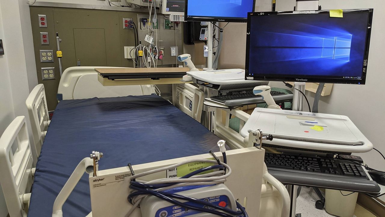 FILE - In this Thursday, April 9, 2020, photo, a patient care room is reconditioned for use during the coronavirus pandemic at the St. Vincent Medical Center building in Los Angeles. The empty hospital near downtown Los Angeles is being leased by the State of California to operate as a healthcare facility during the COVID-19 outbreak in Los Angeles County. (AP Photo/Damian Dovarganes, File)