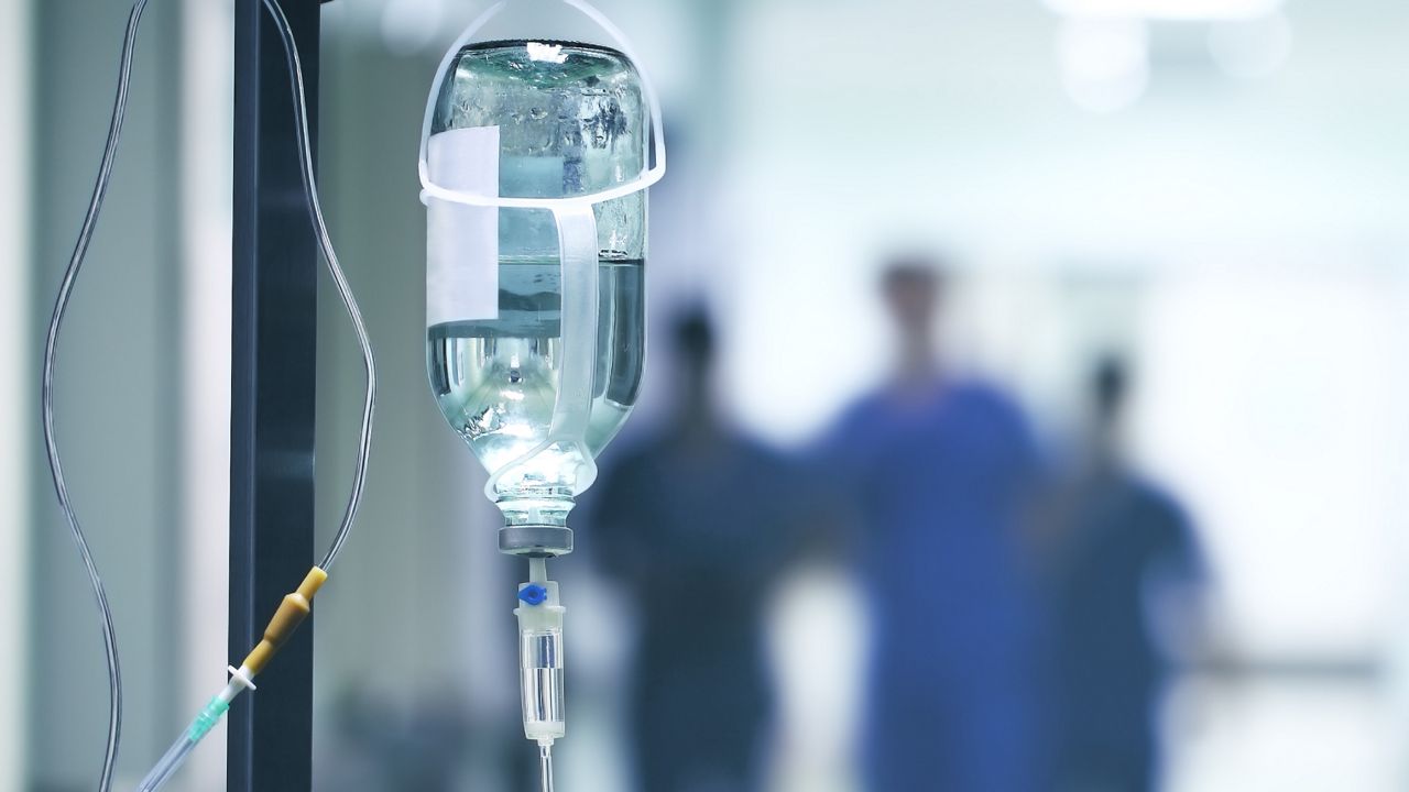 Group of doctors in a hurry down the hospital hallway for emergency