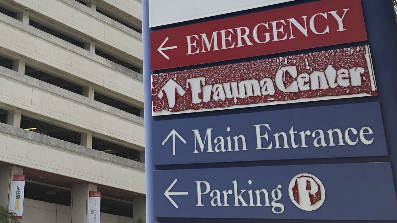 A sign is displayed outside a hospital in Miami, on July 9, 2020. (AP Photo/Wilfredo Lee, File)