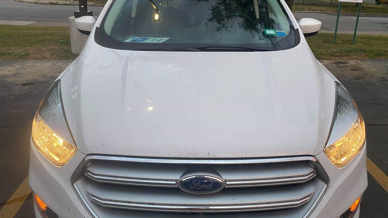 front of a white car