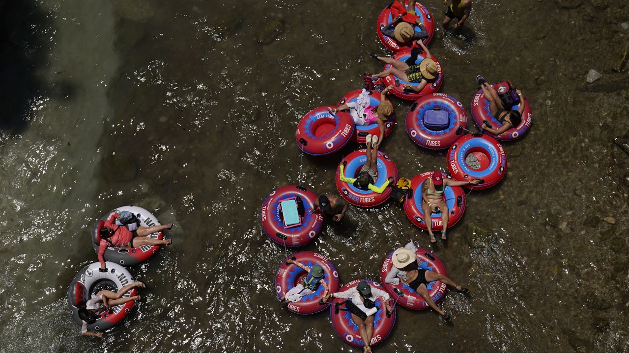 Tubers float the cool Comal River in New Braunfels, Texas, on June 29. (AP Photo/Eric Gay, File)