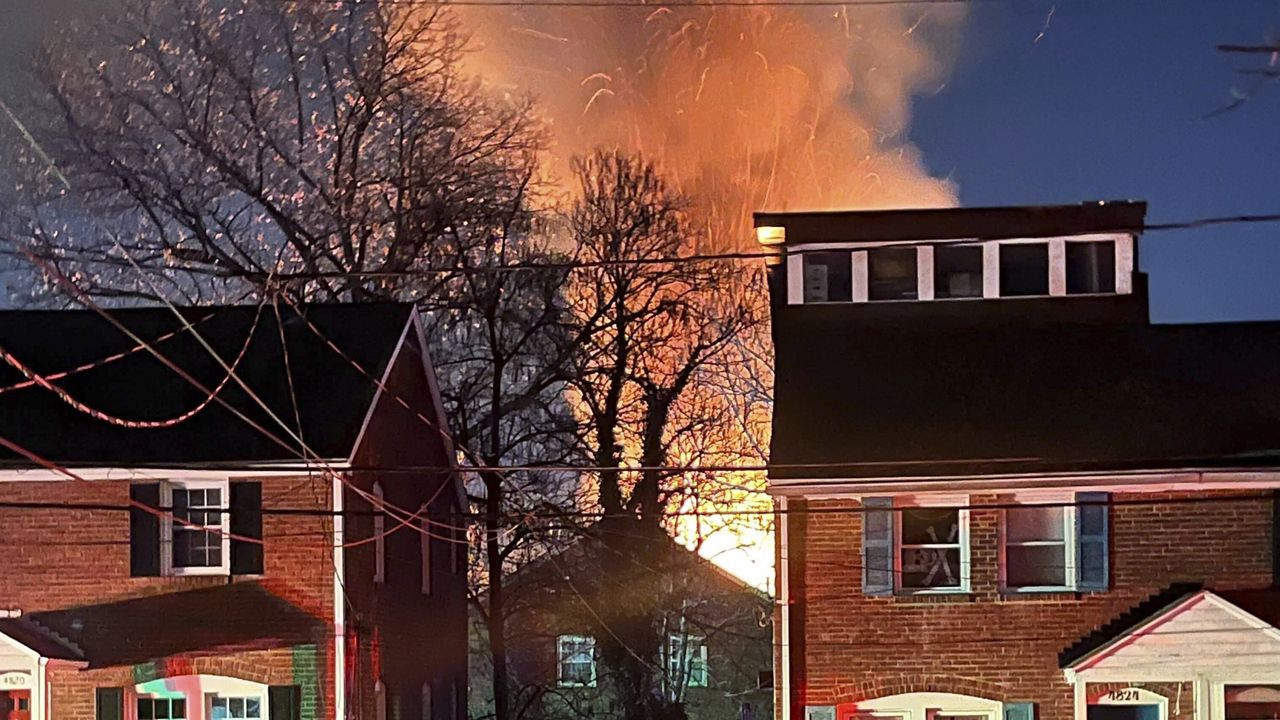 A home is seen exploding from a distance, Monday night, Dec. 4, 2023, in Arlington, Va. (AP Photo)