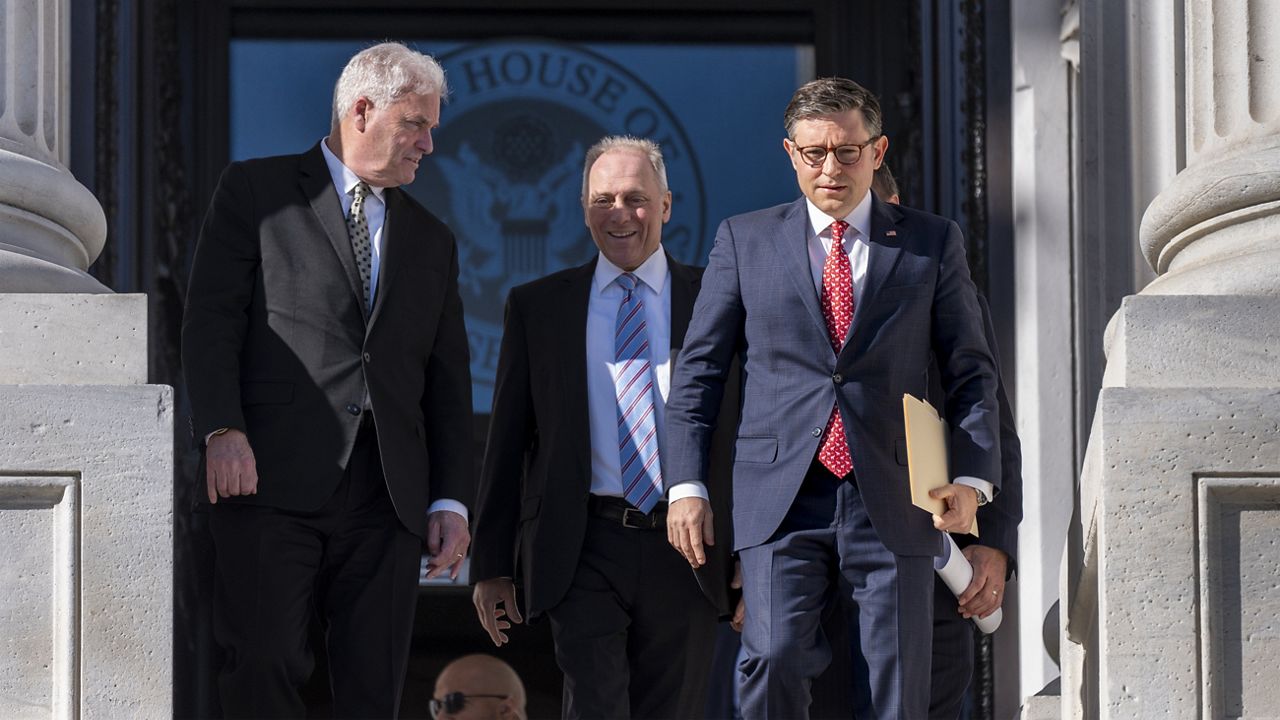 House Speaker Mike Johnson, R-La., right, joined, from left, by Majority Whip Tom Emmer, R-Minn., and House Majority Leader Steve Scalise, R-La., arrives for a news conference on the steps of the Capitol in Washington, Tuesday, Nov. 12, 2024. (AP Photo/J. Scott Applewhite)