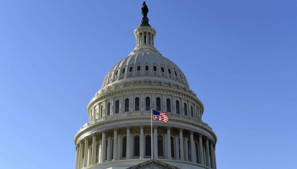 A flag flies on at the U.S. Capitol in Washington, Tuesday, Nov. 28, 2017. The House is scheduled to vote on adopting mandatory anti-sexual harassment training for all members and their staff. The vote comes amid a wave of allegations of sexual misconduct against lawmakers that has thrust the issue of gender hostility and discrimination on Capitol Hill squarely into the spotlight. (Ap Photo/Susan Walsh)