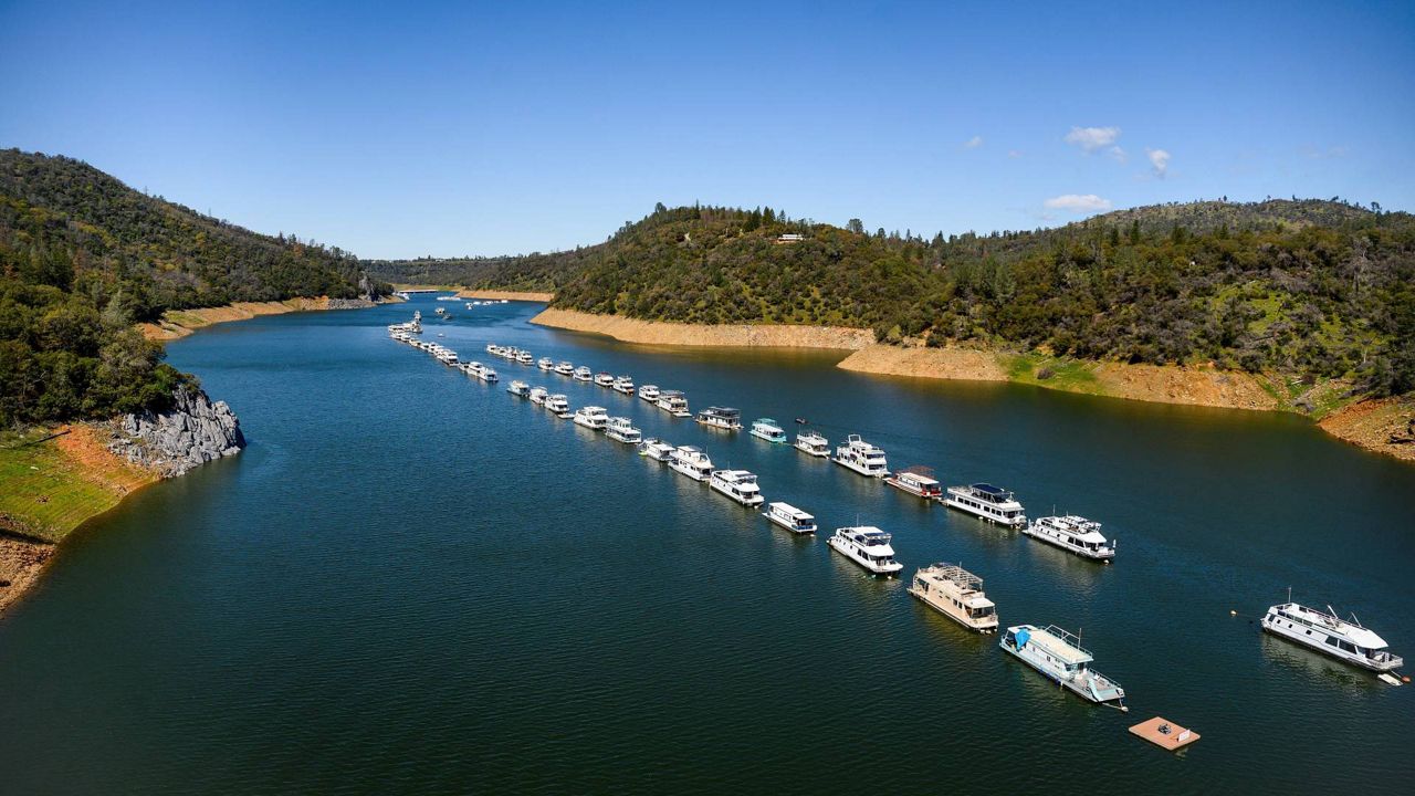 Houseboats float at Lake Oroville State Recreation Area on March 26, 2023, in Butte County, Calif. (AP Photo/Noah Berger)