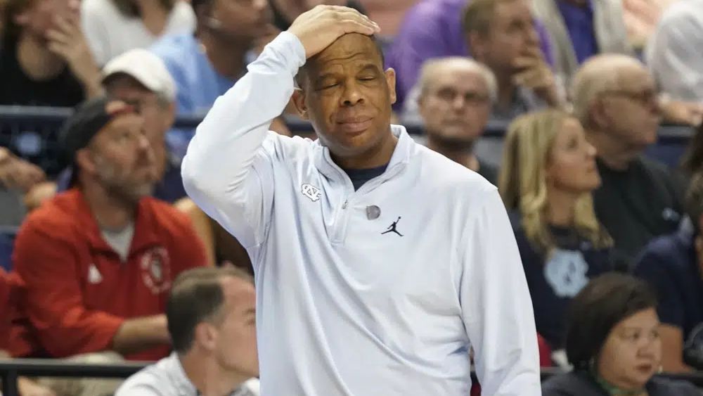 North Carolina head coach Hubert Davis reacts after a turnover during the first half of an NCAA college basketball game against Virginia at the Atlantic Coast Conference Tournament in Greensboro, N.C., Thursday, March 9, 2023. (AP Photo/Chuck Burton)