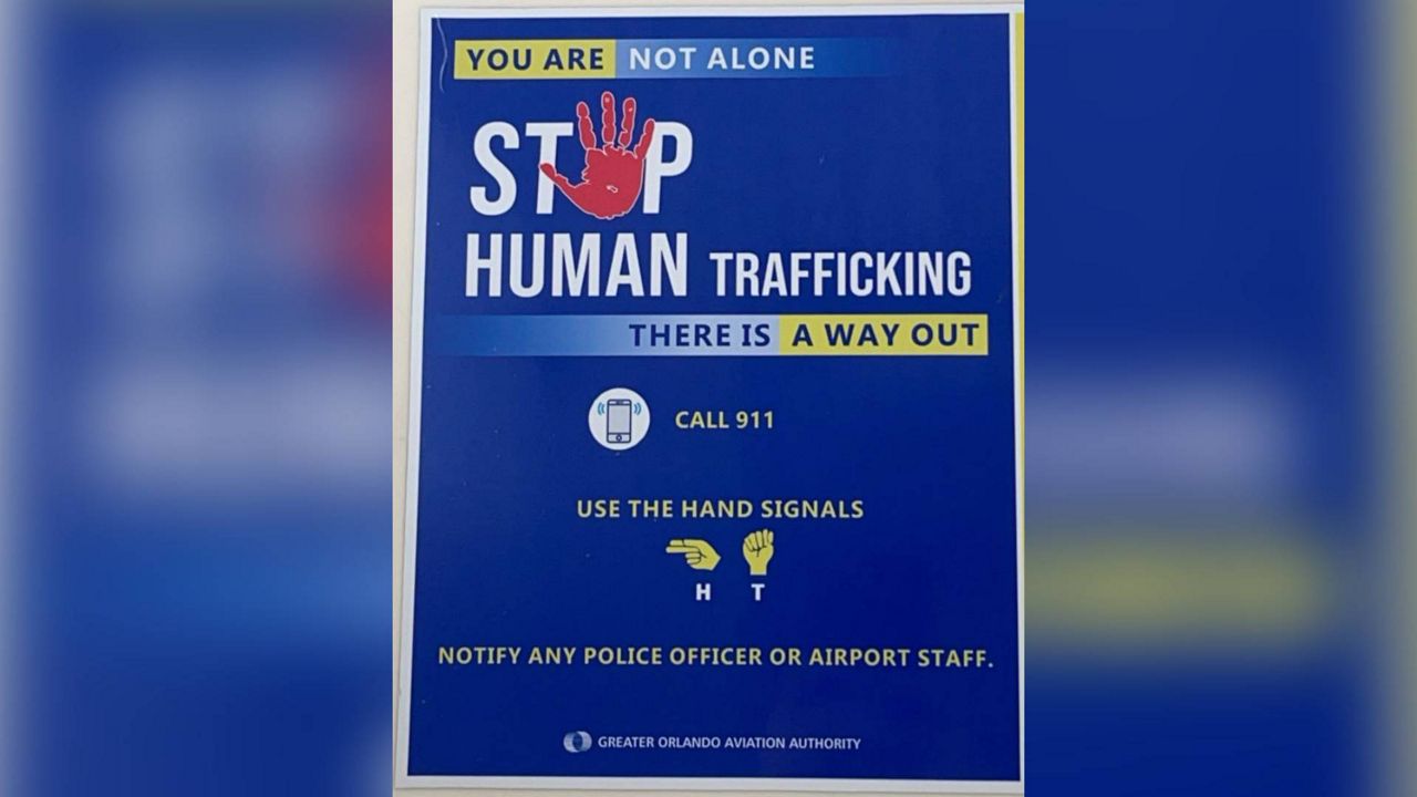 Human trafficking awareness flyer posted in women's restroom stalls at Orlando International Airport. (Courtesy: Adriana Arcomone)